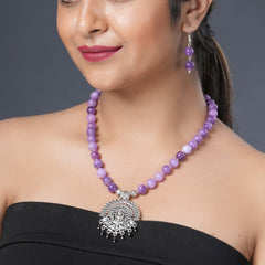 Girl model wearing Eykaa necklace and earrings that features semi precious stone EYKAA PURPLE JADE BRACELET