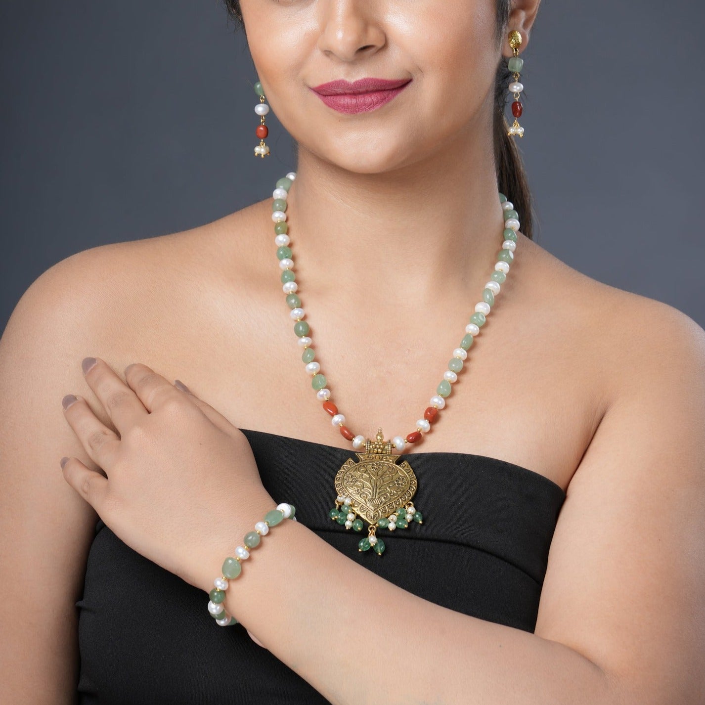 Girl Model Wearing Eykaa Green Aventurine With Freshwater Pearl, Silver Strawberry Quartz, And Shell Pearl Necklace With Earrings And Bracelet.