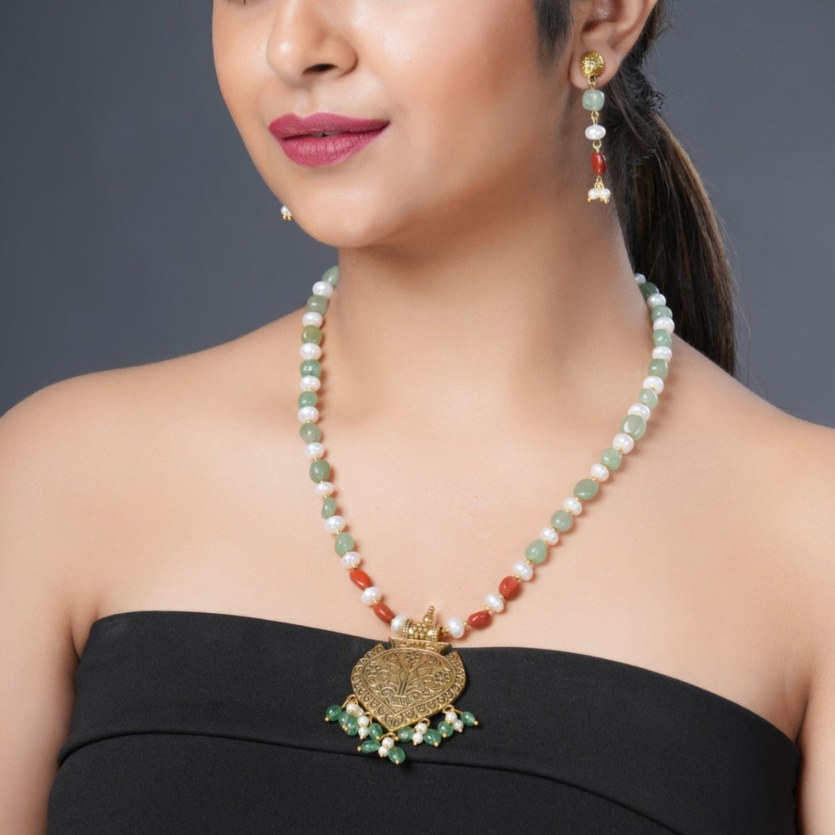 Girl Model Wearing Eykaa Green Aventurine With Freshwater Pearl, Silver Strawberry Quartz, And Shell Pearl Necklace With Earrings.