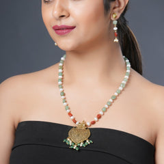 Girl Model Wearing Eykaa Green Aventurine With Freshwater Pearl, Silver Strawberry Quartz, And Shell Pearl Necklace With Earrings.