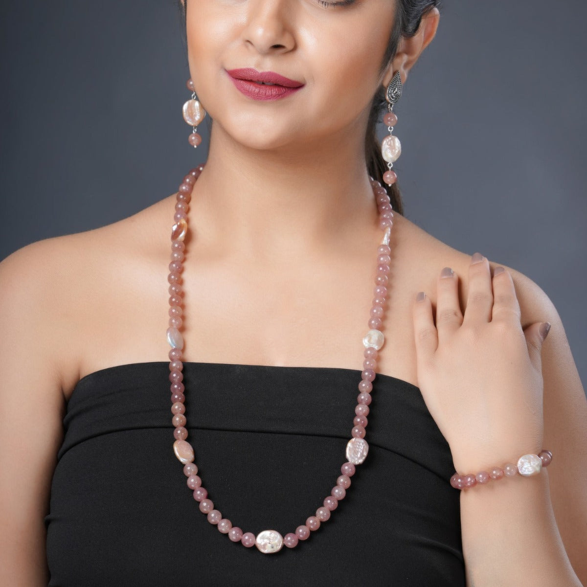 Girl Model Wearing Eykaa Strawberry Quartz And Freshwater Pearl Necklace With Earrings And Bracelet.

Eykaa
stone jewellery
womens jewellery
earing for women
bracelet for women
necklace for women
jewellery stores