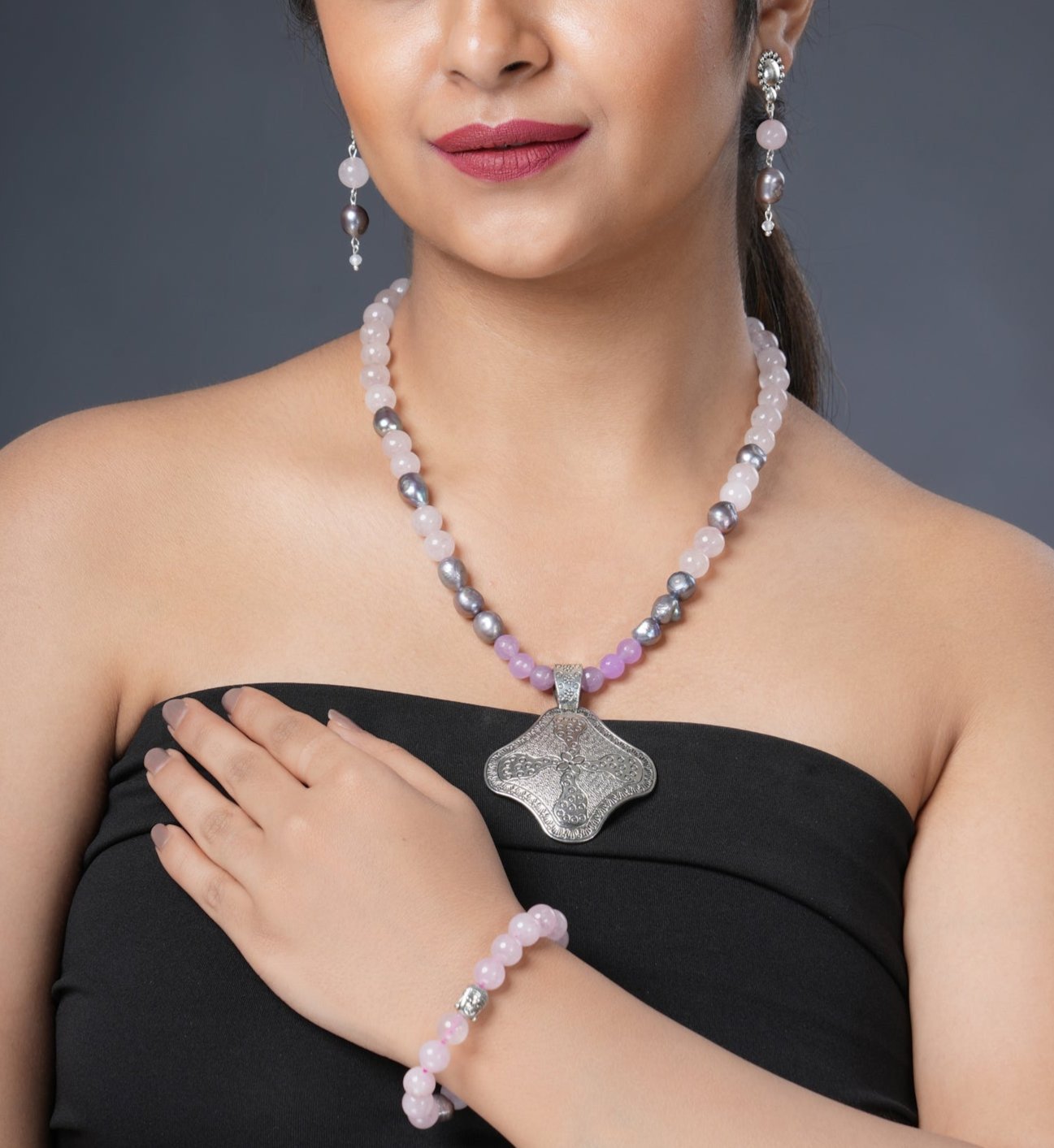 Girl Model Wearing Eykaa Rose Quartz, Jade, And Freshwater Pearl Necklace With Earrings And A Bracelet.