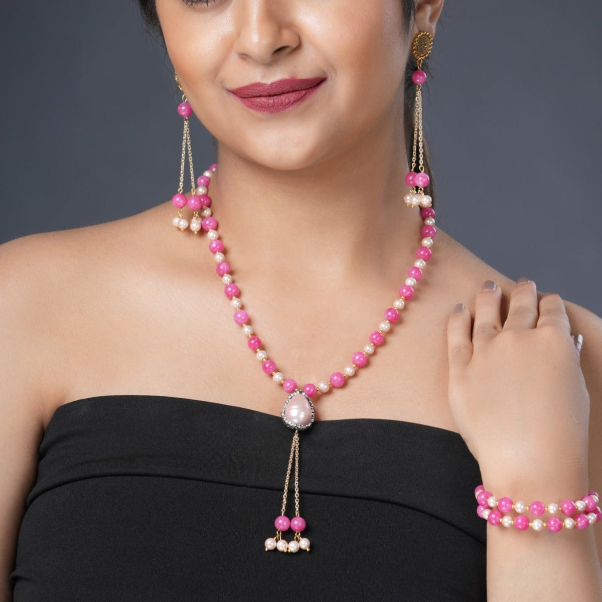 Girl Model Wearing Eykaa Pink Jade With Shell Pearl Necklace With Earrings And A Bracelet.