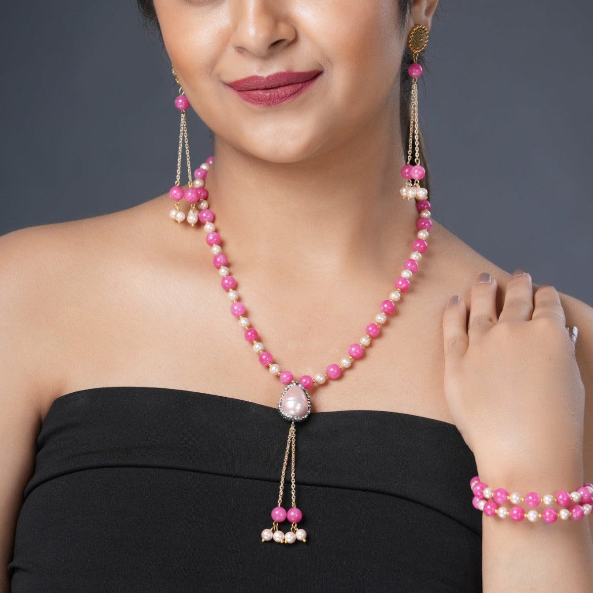 Girl Model Wearing Eykaa Pink Jade With Shell Pearl Necklace With Earrings And A Bracelet.