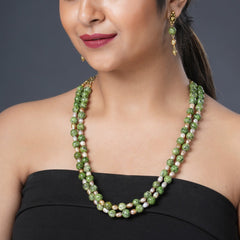 Girl Model Wearing Eykaa Green Dalmatian And Freshwater Pearl Necklace With Earrings.