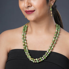 Girl Model Wearing Eykaa Green Dalmatian And Fresh Water Pearl Necklace With Earrings.