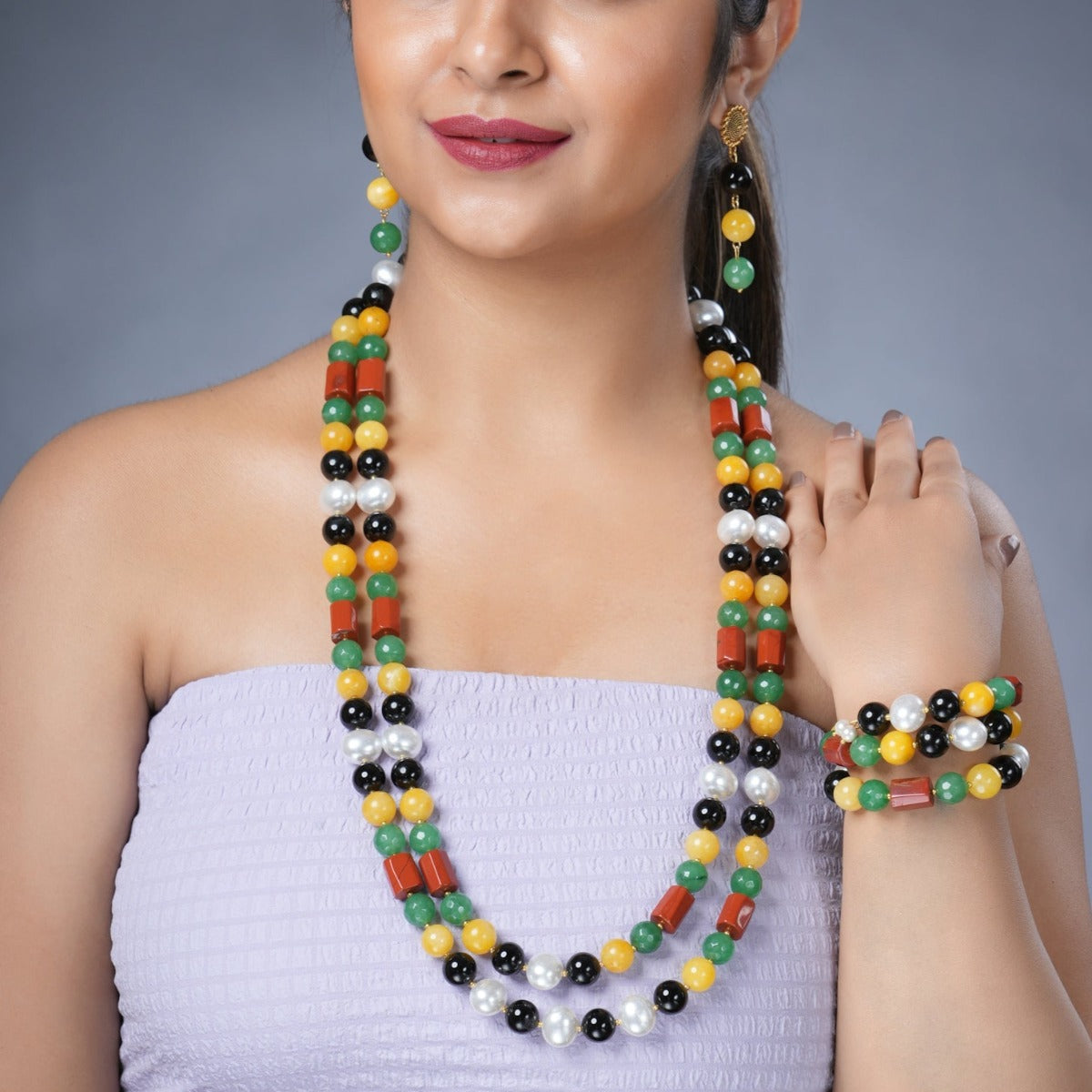 Girl Model Wearing Eykaa Black Onyx, Red Jasper, Green Jade And Yellow Jade With Korean Pearl Ball Necklace With Earrings And  And A Bracelet.