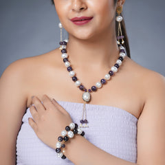 Girl Model Wearing Eykaa Amethyst And Korean Pearl Balls With Shell Pearl Necklace With Earrings And A Bracelet.