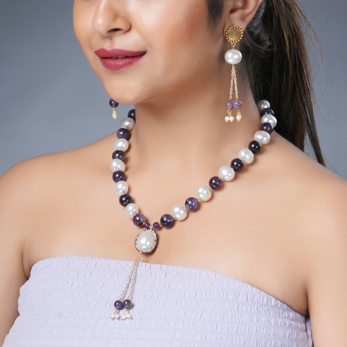 Girl Model Wearing Eykaa Amethyst with Pearl Korean Balls and Shell Pearl Pendant Necklace with Earrings.