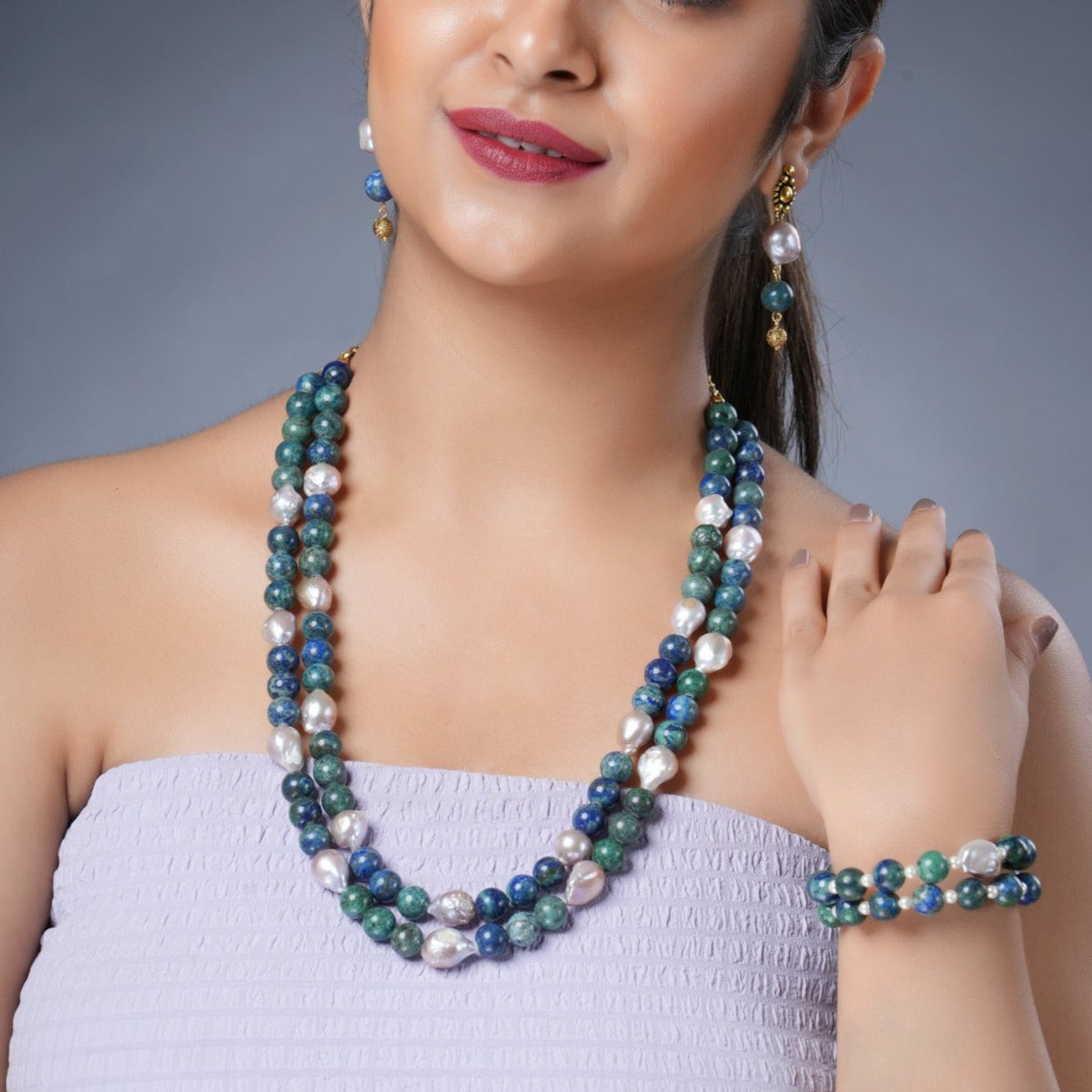 Girl Model Wearing Eykaa Azurite And Freshwater Pearl Necklace With Earrings And Bracelet.

Eykaa
stone jewellery
womens jewellery
earing for women
bracelet for women
necklace for women
jewellery stores