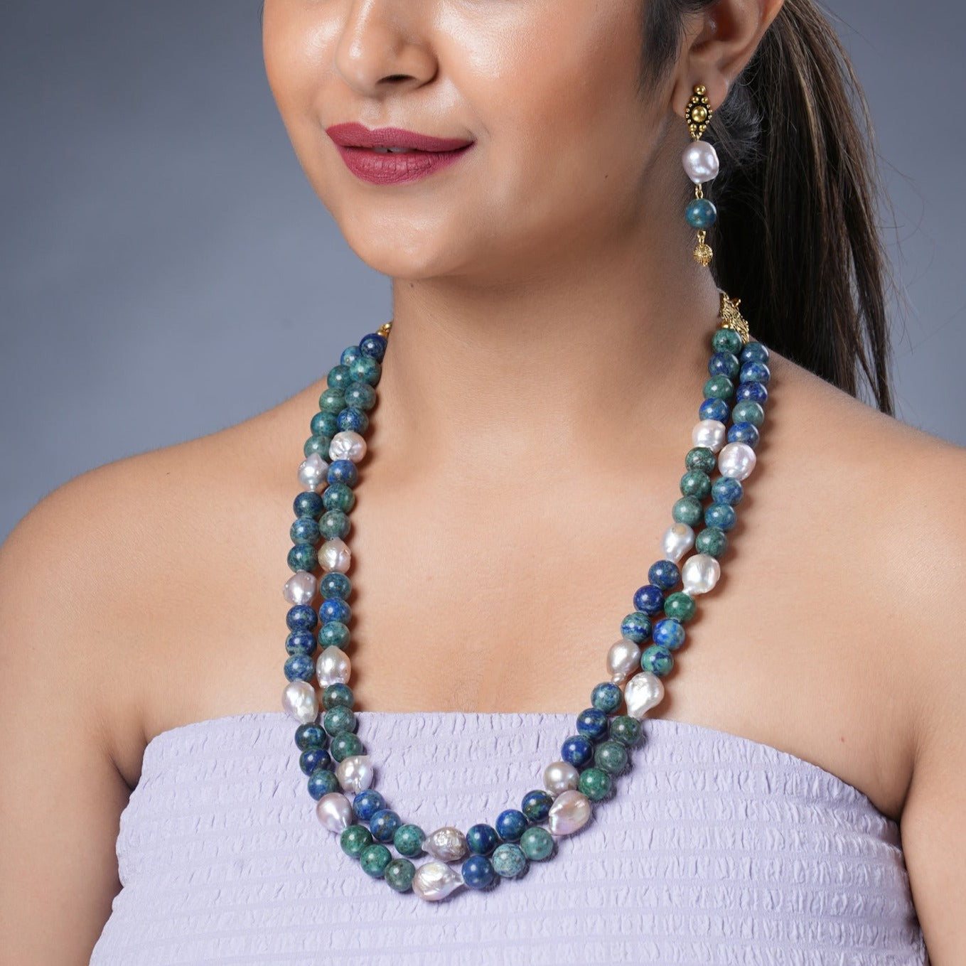   Girl Model Wearing  Eykaa Azurite And Freshwater Pearl Necklace With Earrings. 

Eykaa
stone jewellery
womens jewellery
earing for women
bracelet for women
necklace for women
jewellery stores