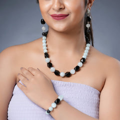 Girl Model Wearing Eykaa  Aquamarine With Lava And Black Onyx Statement Necklace With Earrings And A Bracelet.