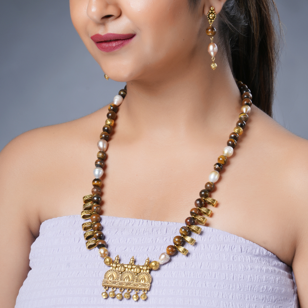 Girl Model Wearing Eykaa Freshwater Pearl And Tiger Eye Necklace With Earrings.

Eykaa
stone jewellery
womens jewellery
earing for women
bracelet for women
necklace for women
jewellery stores