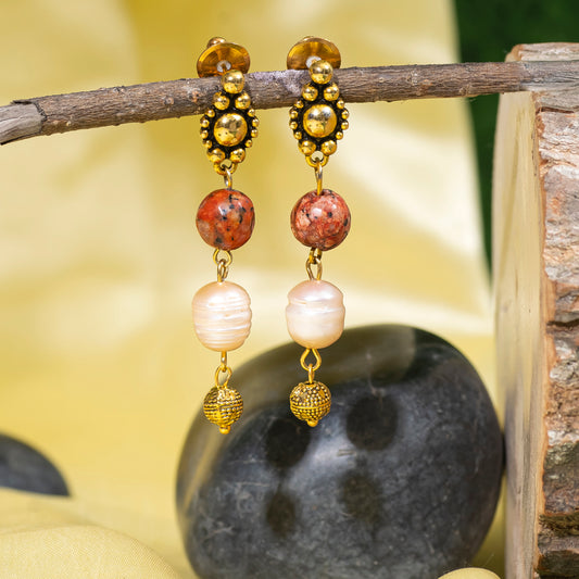 Eykaa Orange Dalmatian And Freshwater Pearl Earrings Hanging On The Tree Branch.