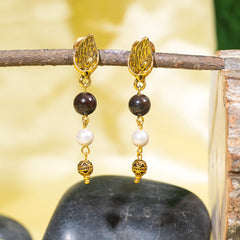 Eykaa Garnet With Fresh Water Pearl And Shell Pearls Earring Hanging On The Tree Branch.