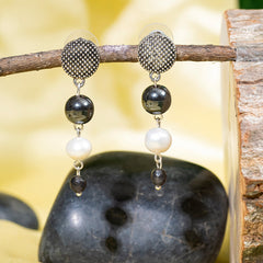 Eykaa Hematite And Freshwater Pearl Earrings Hanging On The Tree Branch.