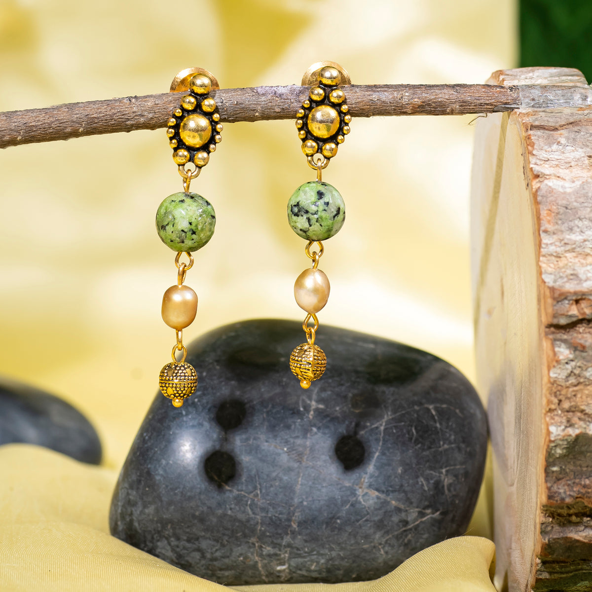 Eykaa Green Dalmatian And Fresh Water Pearl Earrings Hanging On The Tree Branch.