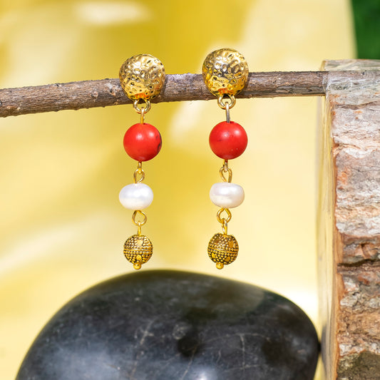 Eykaa Red Howlite And Freshwater Pearl Earrings Hanging On The Tree Branch.