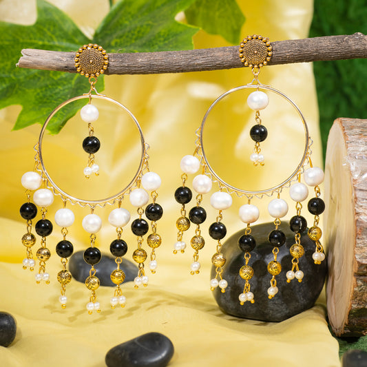 Eykaa Black Jasper With Freshwater Pearl And Shell Pearl Earrings Hanging On The Tree Branch.