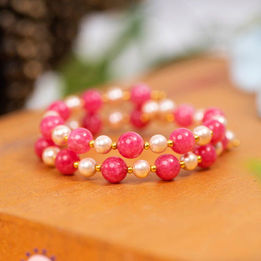 Eykaa Pink Jade With Shell Pearl And Shell Pearl Bracelet On A Smooth Wooden Surface.