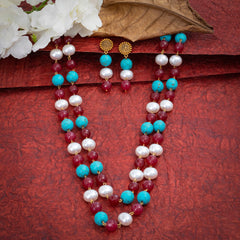 Eykaa Firoza And Maroon Jade With Korean Pearl Ball Layered Necklace With Earrings On A Textured Red Background With White Flowers.
Eykaa
stone jewellery
womens jewellery
earing for women
bracelet for women
necklace for women
jewellery stores