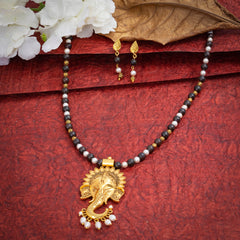 Eykaa Garnet With Fresh Water Pearl And Shell Pearls Necklace And Earring On A Textured Red Background With White Flowers.