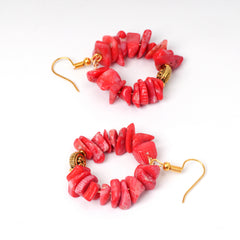 Eykaa Pure Coral Earrings On A White Background.