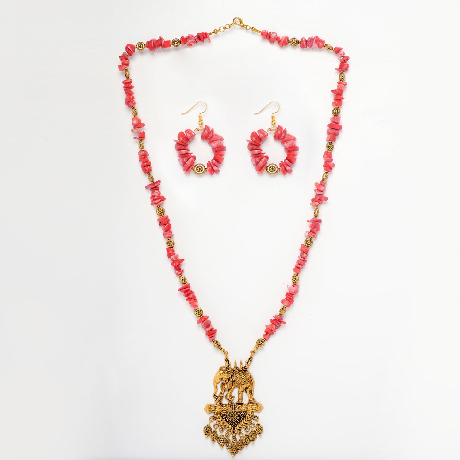 Eykaa Pure Coral Necklace With Earrings On A White Background.