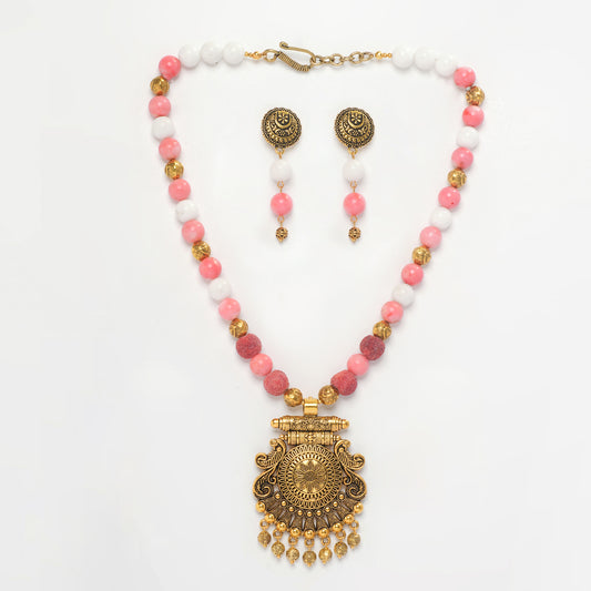 Eykaa Marble, Coral And Bamboo Coral Necklace With Golden Beads Pendant And Earrings On A White Background.