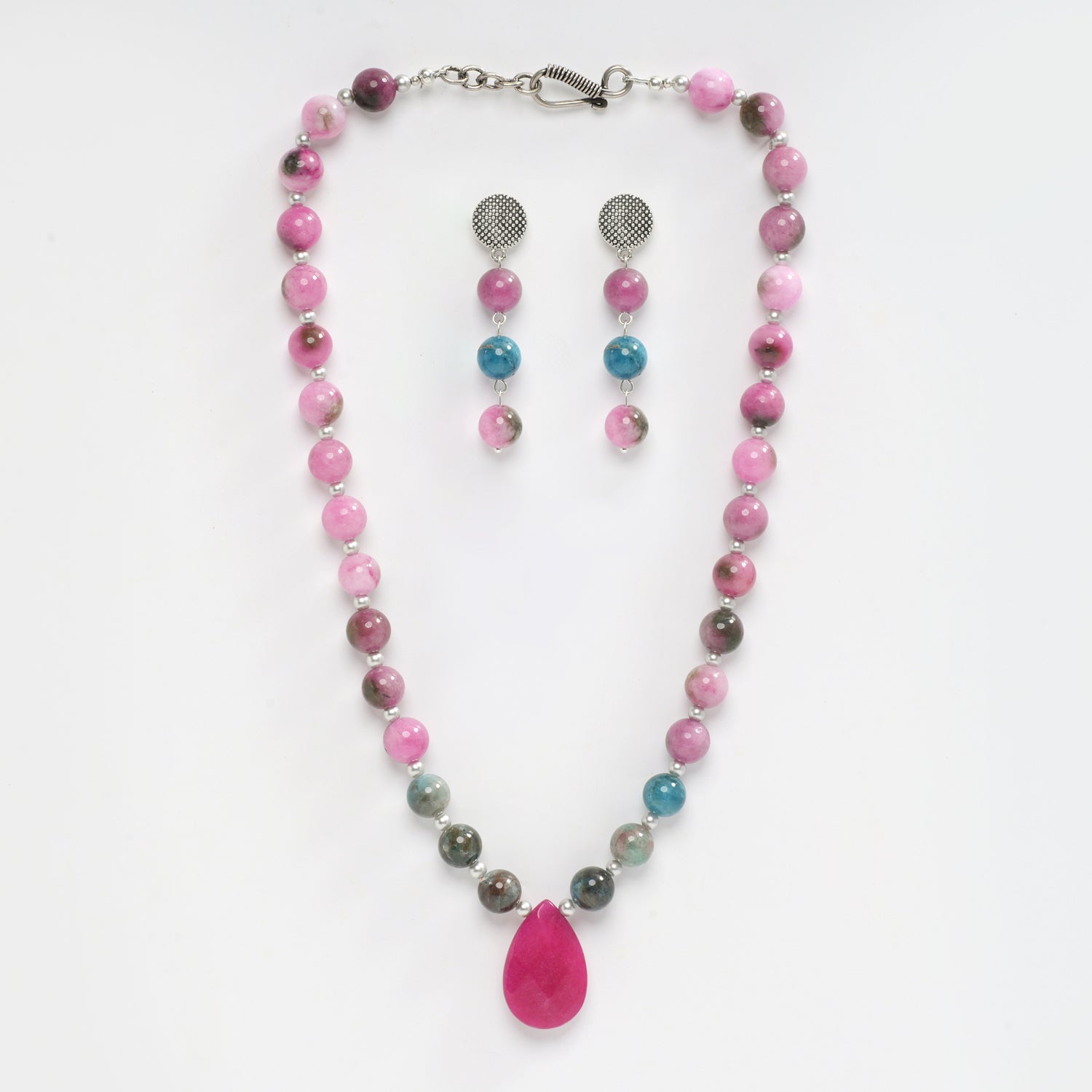 Eykaa necklace and earrings that feature pink jade, blue apatite with pink agate  semi precious stones with white background.