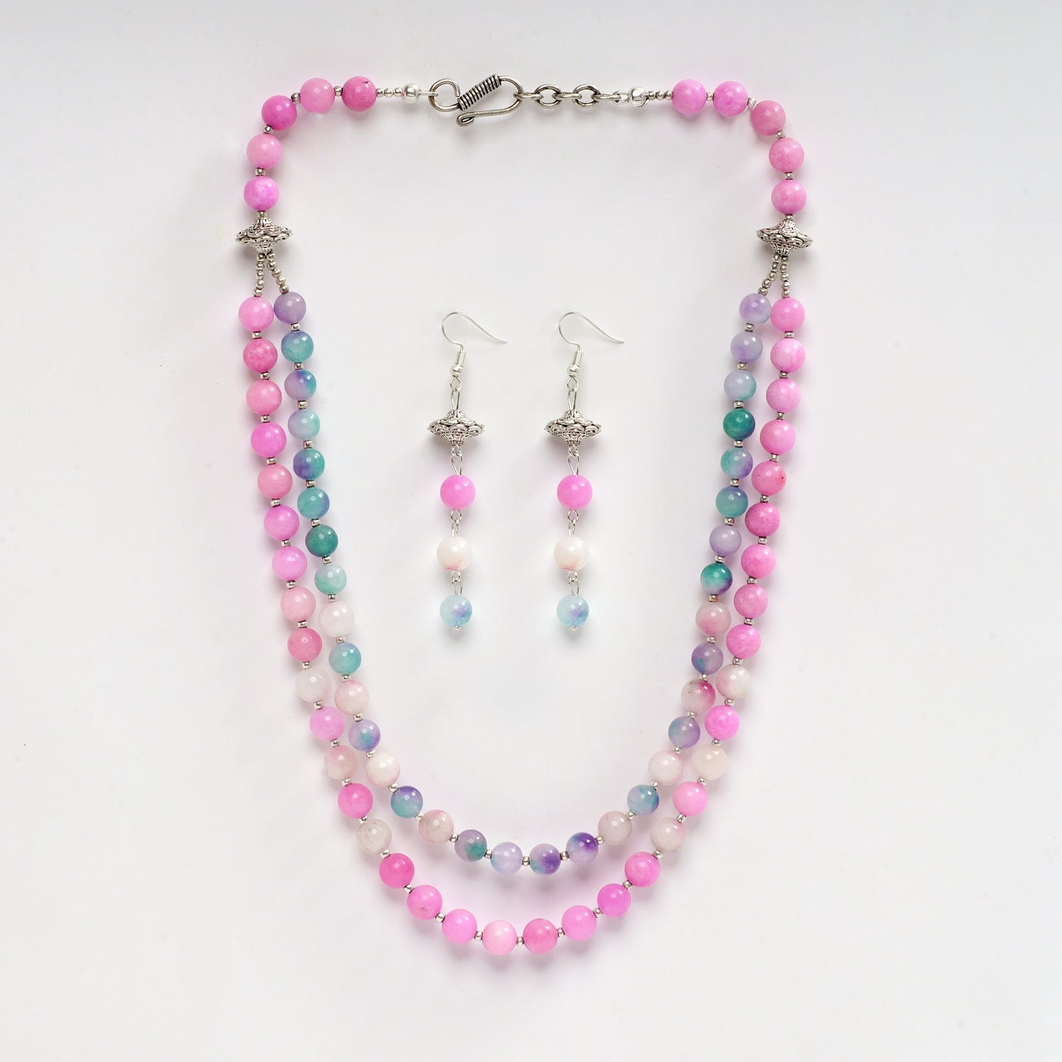 Eykaa brand pink and multicoloured semi precious stone jade layered necklace and earrings with white background.