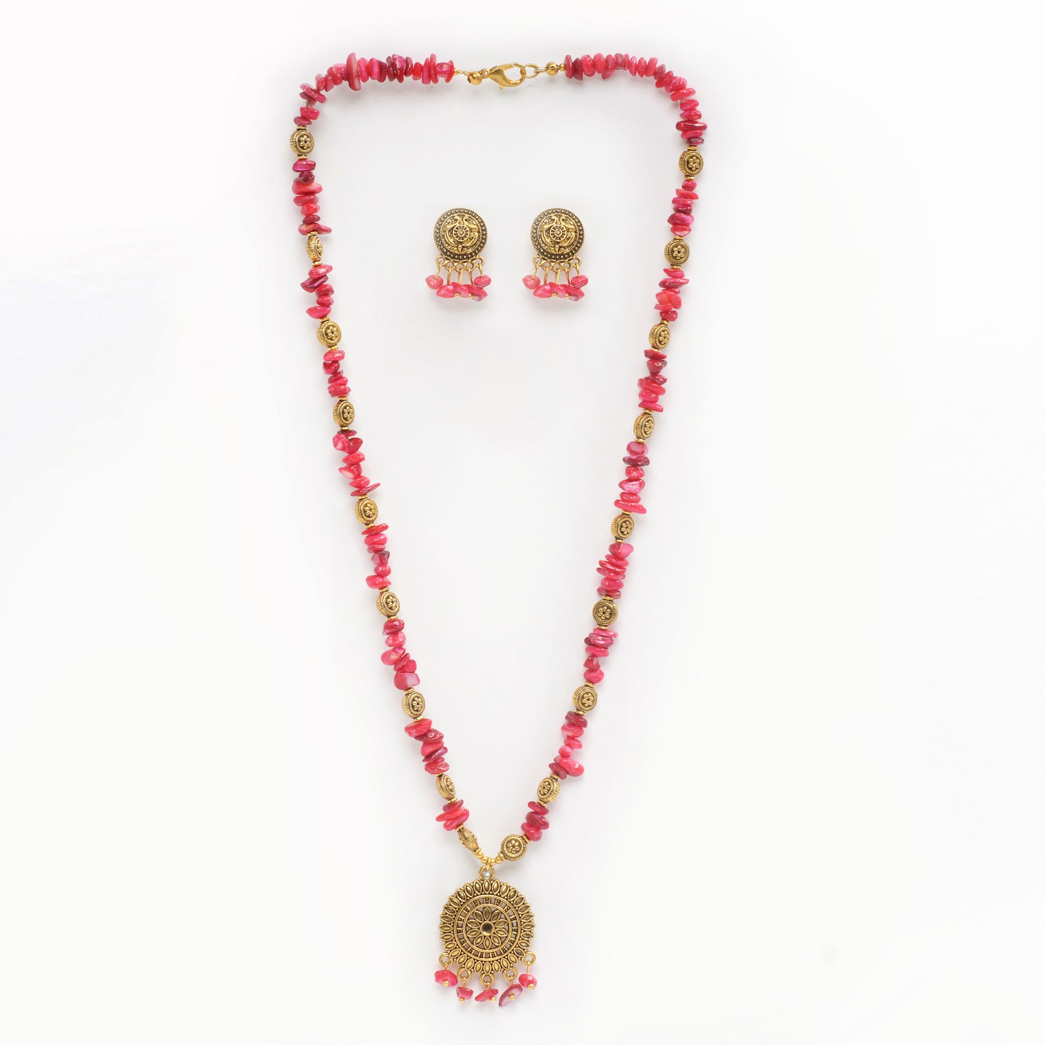 Eykaa brand necklace and earrings features red mother of pearl semi precious stone with white background.