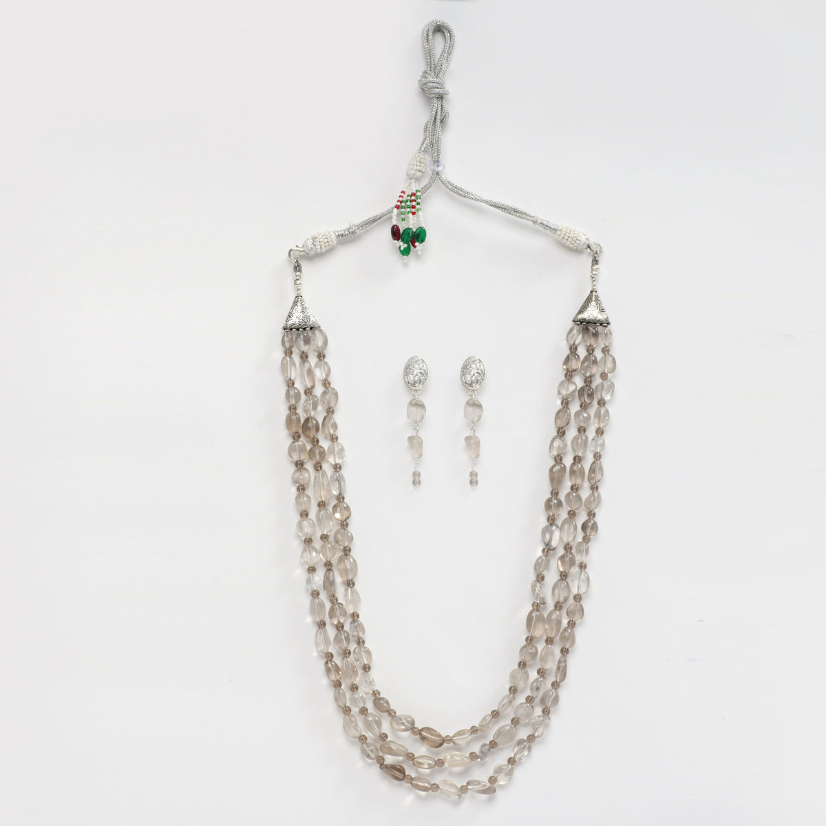  Eykaa brand tumble layered necklace features smokey quartz semi precious stones with white background.