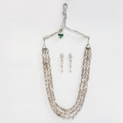  Eykaa brand tumble layered necklace features smokey quartz semi precious stones with white background.