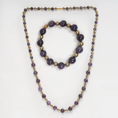 Eykaa black onyx, black tourmaline, and agate semi precious stone necklace and bracelet on white background.