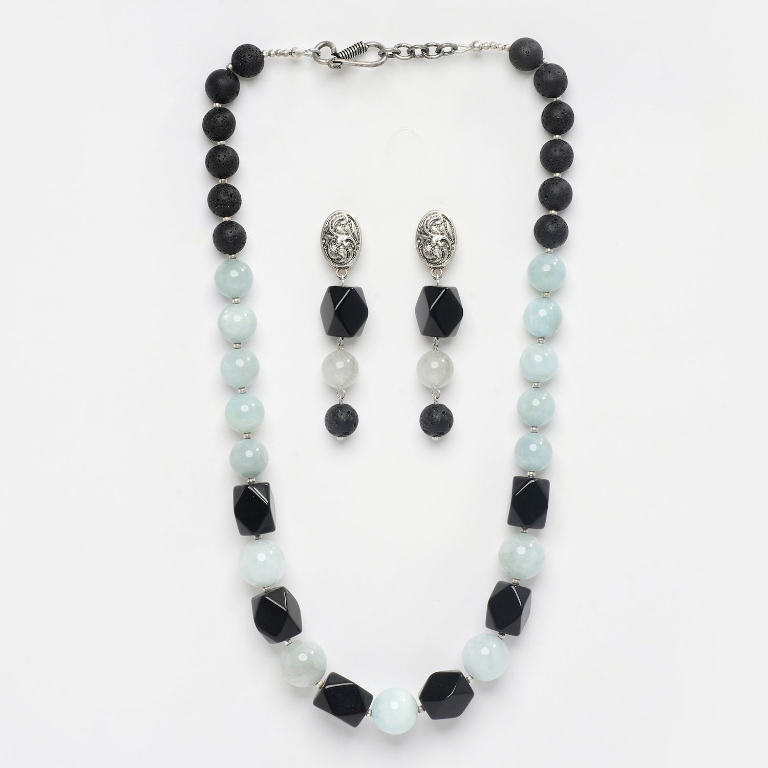 Eykaa  Aquamarine With Lava And Black Onyx Statement Necklace With Earrings On A White Background.