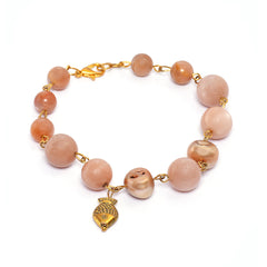 Eykaa peach moonstone with freshwater pearl and shell pearls semi precious stone bracelet with white background.