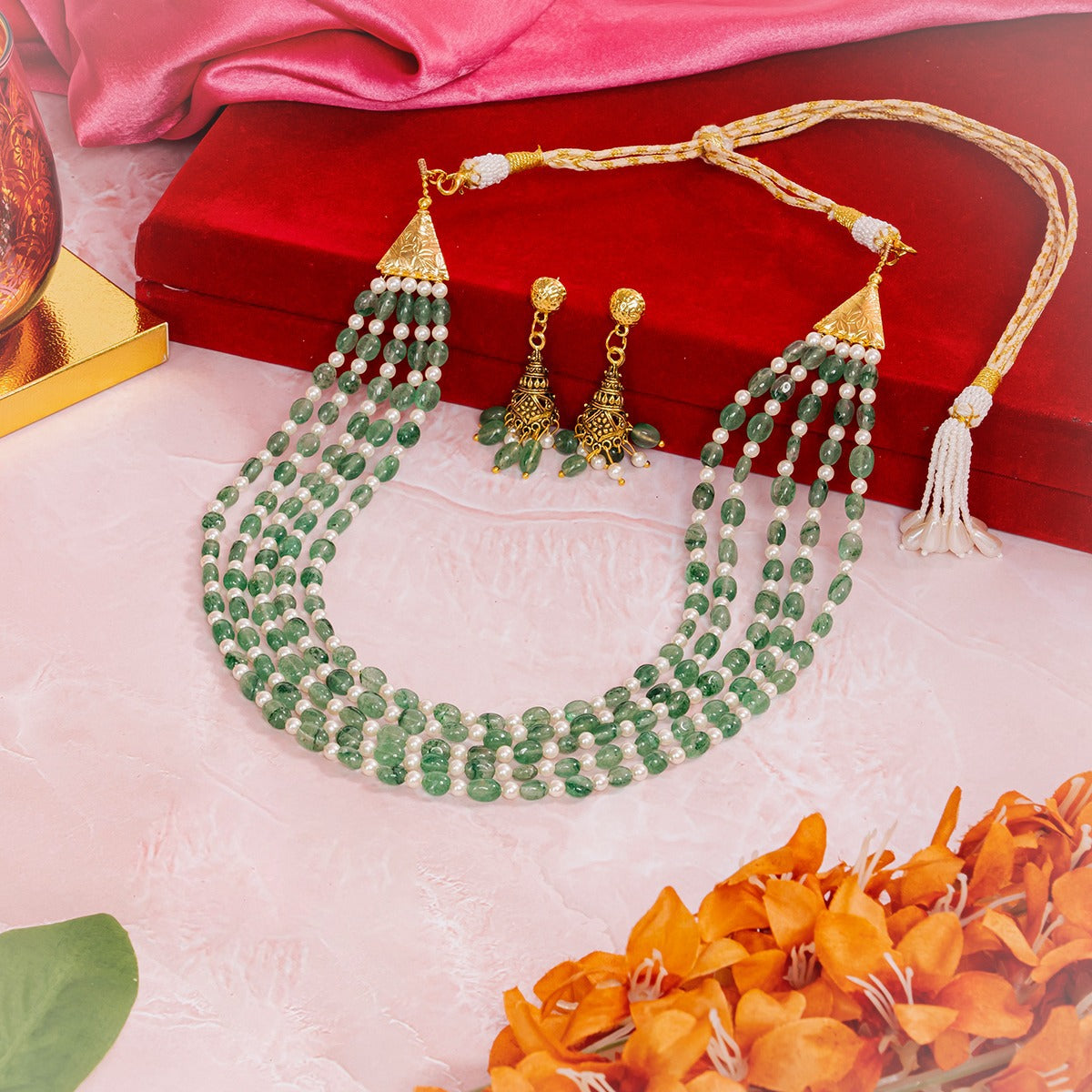 Eykaa green strawberry quartz and shell pearls semi precious stone necklace and earrings on light pink surface

Eykaa
stone jewellery
womens jewellery
earing for women
bracelet for women&nbsp;
necklace for women&nbsp;
jewellery stores